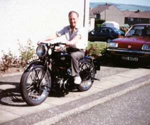Tommy at home on his vintage AJS in the 1980's, the bike still owned by his son Ian.