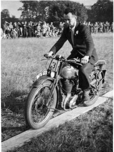 Tommy Milton with his Ariel DFS122 at a Gymkhana event riding the plank!